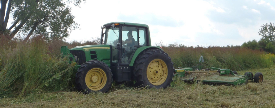 Carl Zenger mows a field near O’Brien Marsh