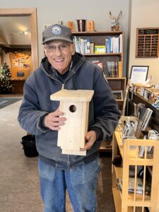 Iroquois National Wildlife Refuge volunteer Carl Zenger of Lockport, with one of the many birdhouses he has built over the years. 
